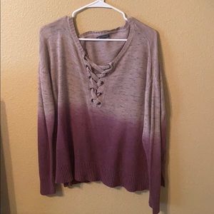 A sweater with cross design in the front!